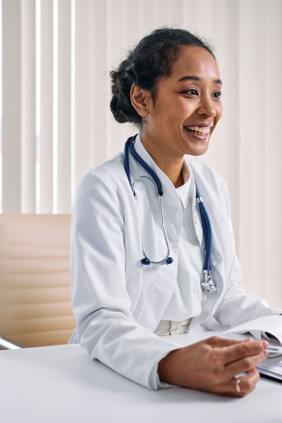 Front-office staff working at a computer in a modern clinic